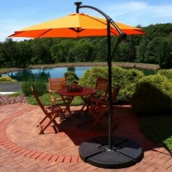 Sunnydaze Decor Sunnydaze Outdoor Steel Cantilever Offset Patio Umbrella with Solar LED Lights, Air Vent, Crank, and Base - 9' - Tangerine